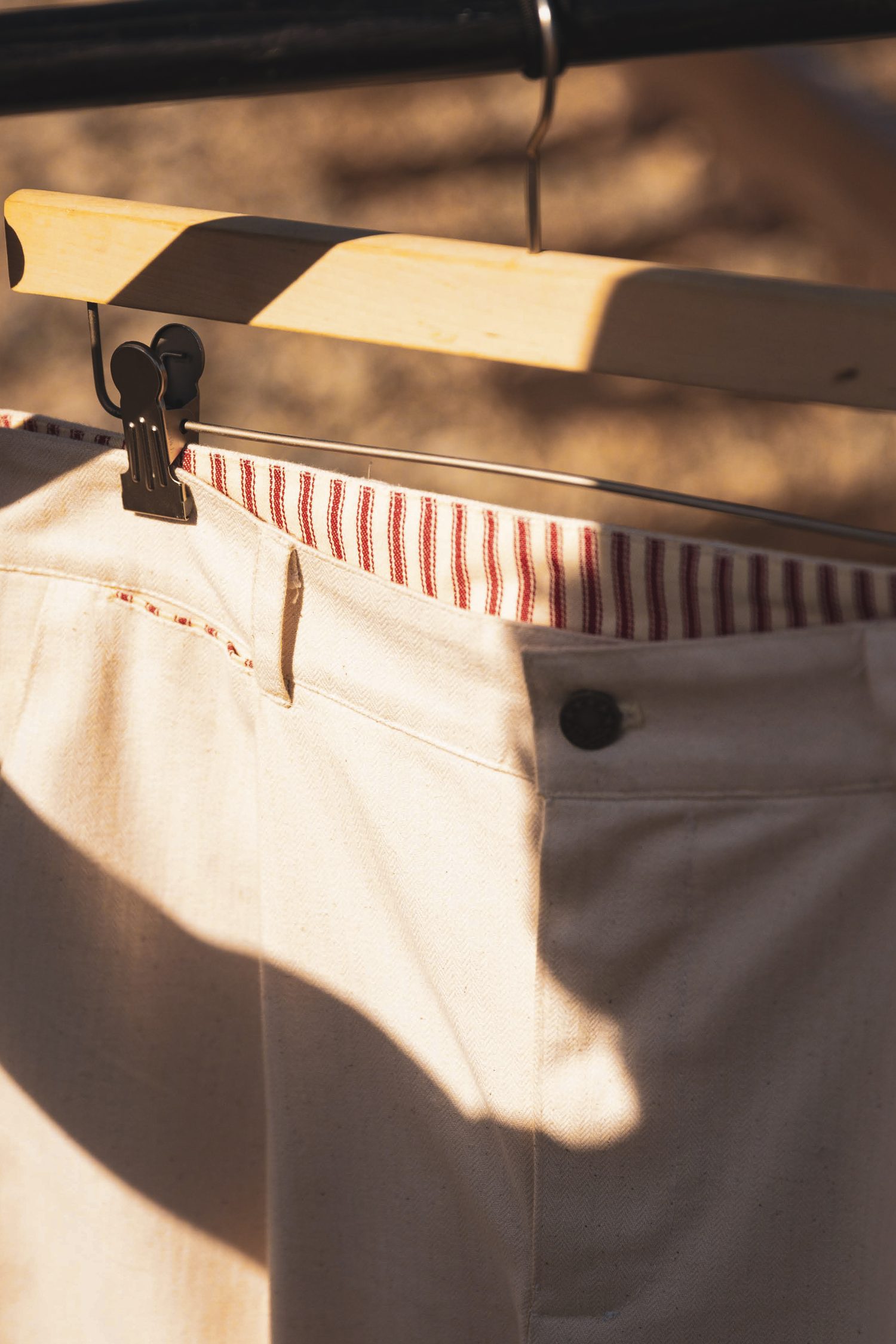 Red ticking stripe lining the waistband and coin pocket.